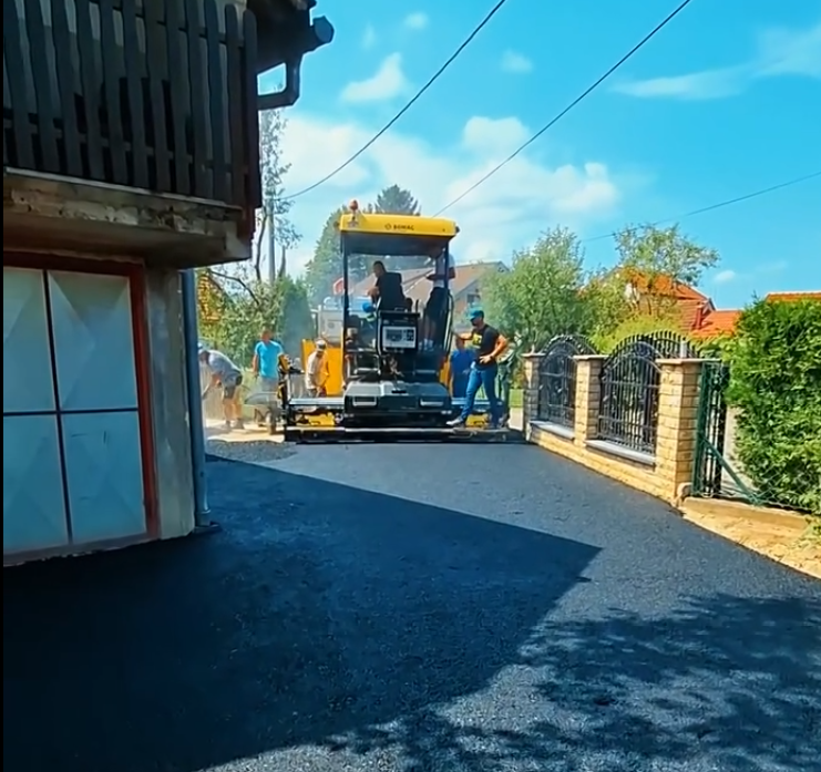 Radovi na asfaltiranju Ulice Treće satnije HVO-a u naselju Kralje, Bihać